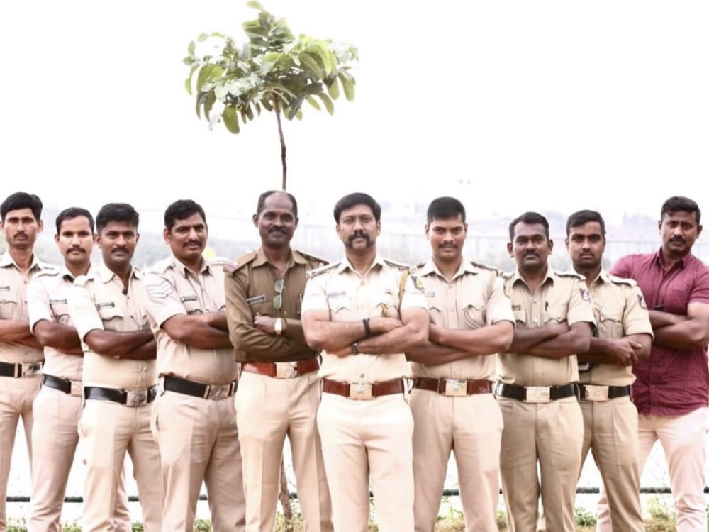 The greener beat — Inspector Rajesh with his station team on a tree-planting drive.